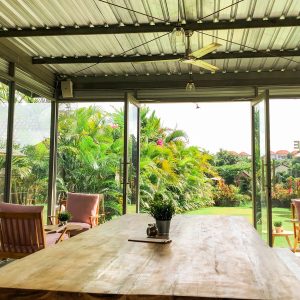 Cafe table with the tropical outdoor area
